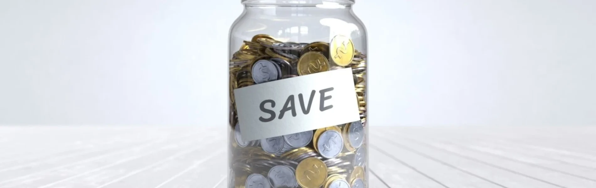 Jar full of coins representing a savings account and financial growth