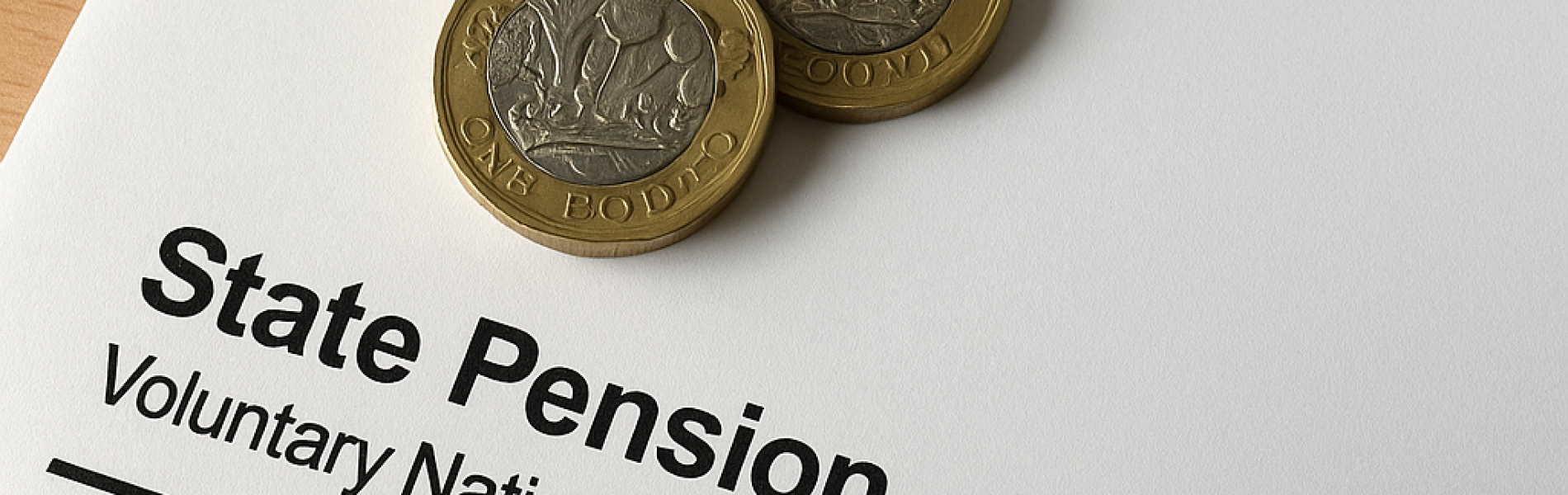 paper of state pension with penny on it